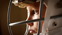 Young boy wearing a football helmet