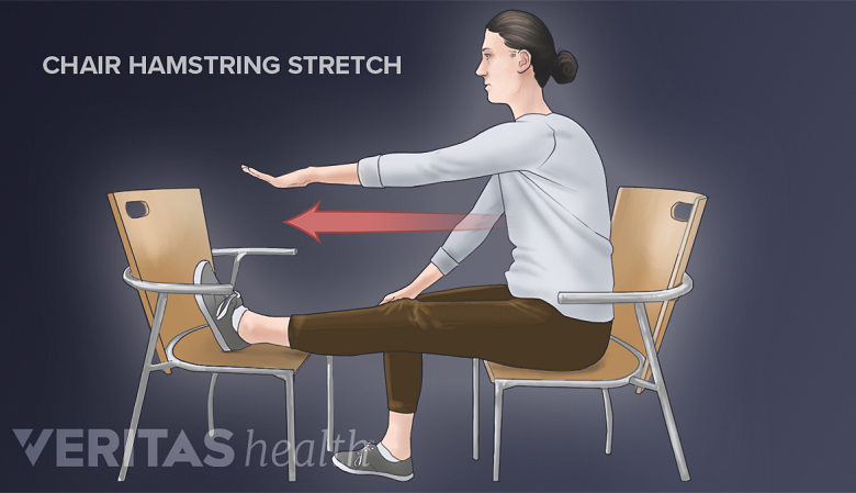 A woman showing seated hamstring stretch exercise.