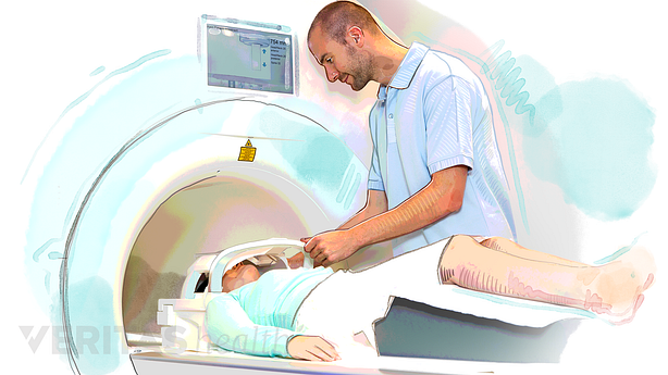 A technician performing an MRI scan on a patient.