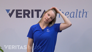 Woman doing a lateral neck flexion.