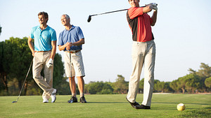 Three men on the golf course