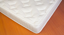 Close up of a plush mattress.