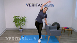 Woman doing an IT band stretch.