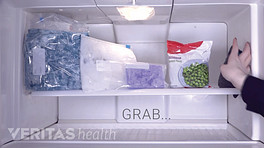 Open view of a freezer with various types of ice packs