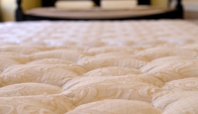 Closeup of plush mattress.