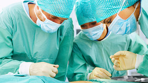 Surgeons operating in an operating room