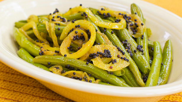 Bowl of green beans with mustard seeds