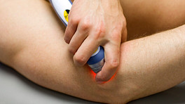 Cold Laser Therapy being performed on the leg