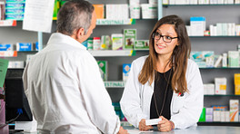 Pharmacist and customer having a consultation.