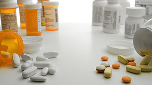 Prescription and non prescription pill bottles some spilledo ut