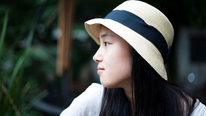 Young woman gazing off thoughtfully
