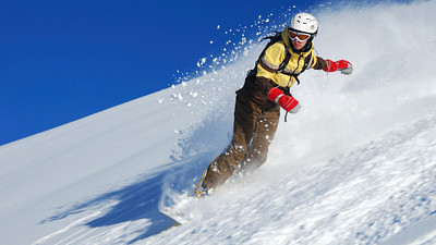 Snowboarding down a mountain