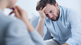 Man speaking with a therapist