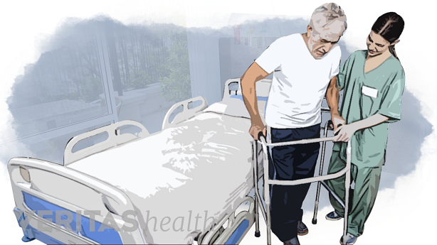 Un cuidador ayudando a un paciente con una andadera.