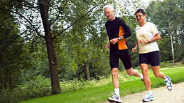 Senior couple running in the park