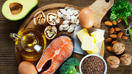 Healthy foods including salmon, eggs, broccoli and nuts
