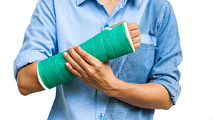 Wrist and arm wrapped in a cast.