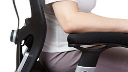 Woman sitting in ergonomic office chair