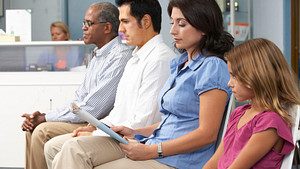 Several patients in a doctors waiting room