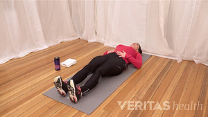Woman doing a Supine Piriformis Muscle Stretch