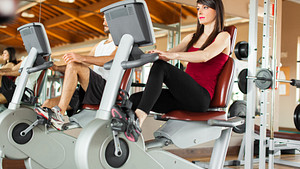 Woman riding a stationary bike at the gym