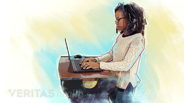 A women using standing desk for work.
