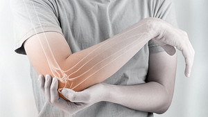 Elbow pain in a skeletal view of the arm.