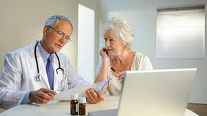 Doctor reviewing test results with a female patient