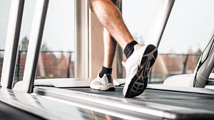 Closeup of feet walking on a treadmill