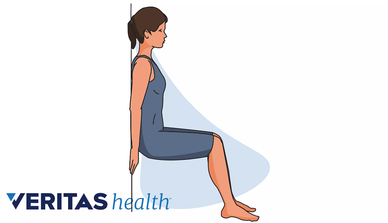 Woman doing wall squats for knee strengthening