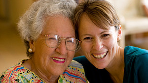 Elderly woman and a younger woman smiling