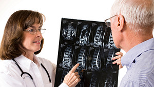 Doctor reviewing CT results with patients.