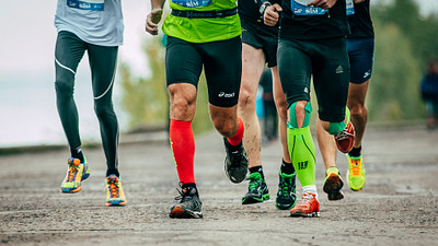 Group of runners wearing different types of compression garments