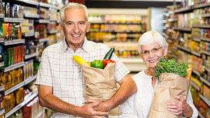 Senior couple shopping at a grocery store.