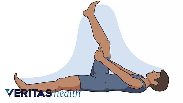Illustration of a person performing the lying hamstring stretch