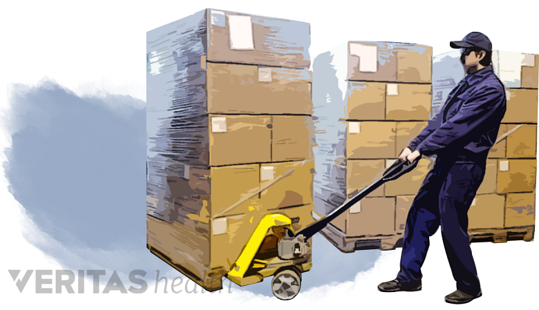 Filtered image of a man pulling a stack of boxes.