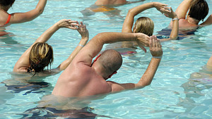 Group doing water aerobics in a pool.