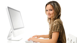 Woman sitting at a desk in front of a computer